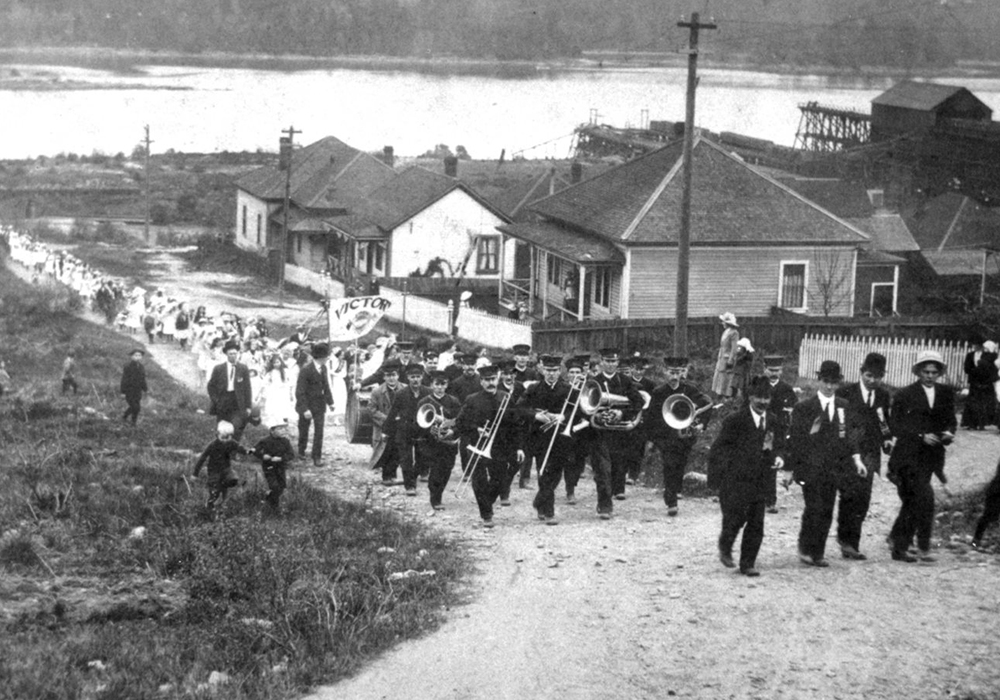 Black and white photomontage featuring a smiling Red Robinson and early 1960s Rock and Roll stars including Jerry Lee Lewis playing piano, Buddy Knox playing electric guitar, Bobby Curtola singing into a microphone, Roy Orbison playing electric guitar and Conway Twitty smiling into the camera.