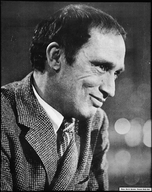 Profile portrait of politician Pierre Elliott Trudeau. The 49 year-old is wearing a jacket and tie with a houndstooth pattern.