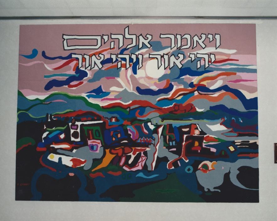 A colourful tapestry depicting the biblical narrative of the creation of light, with Hebrew text around the border.
