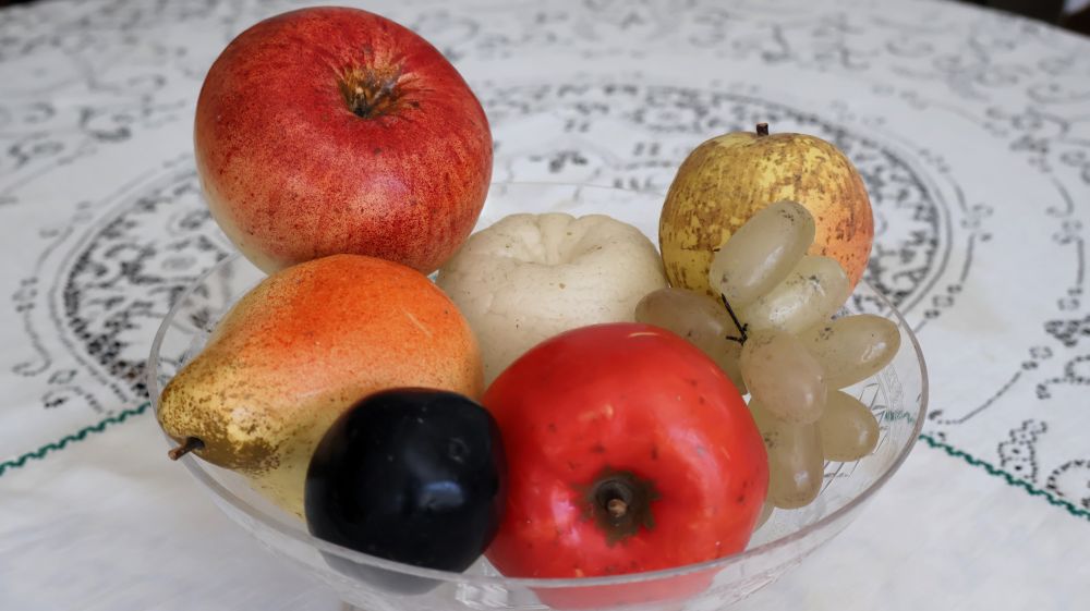 Bowl containing decorative wax fruits
