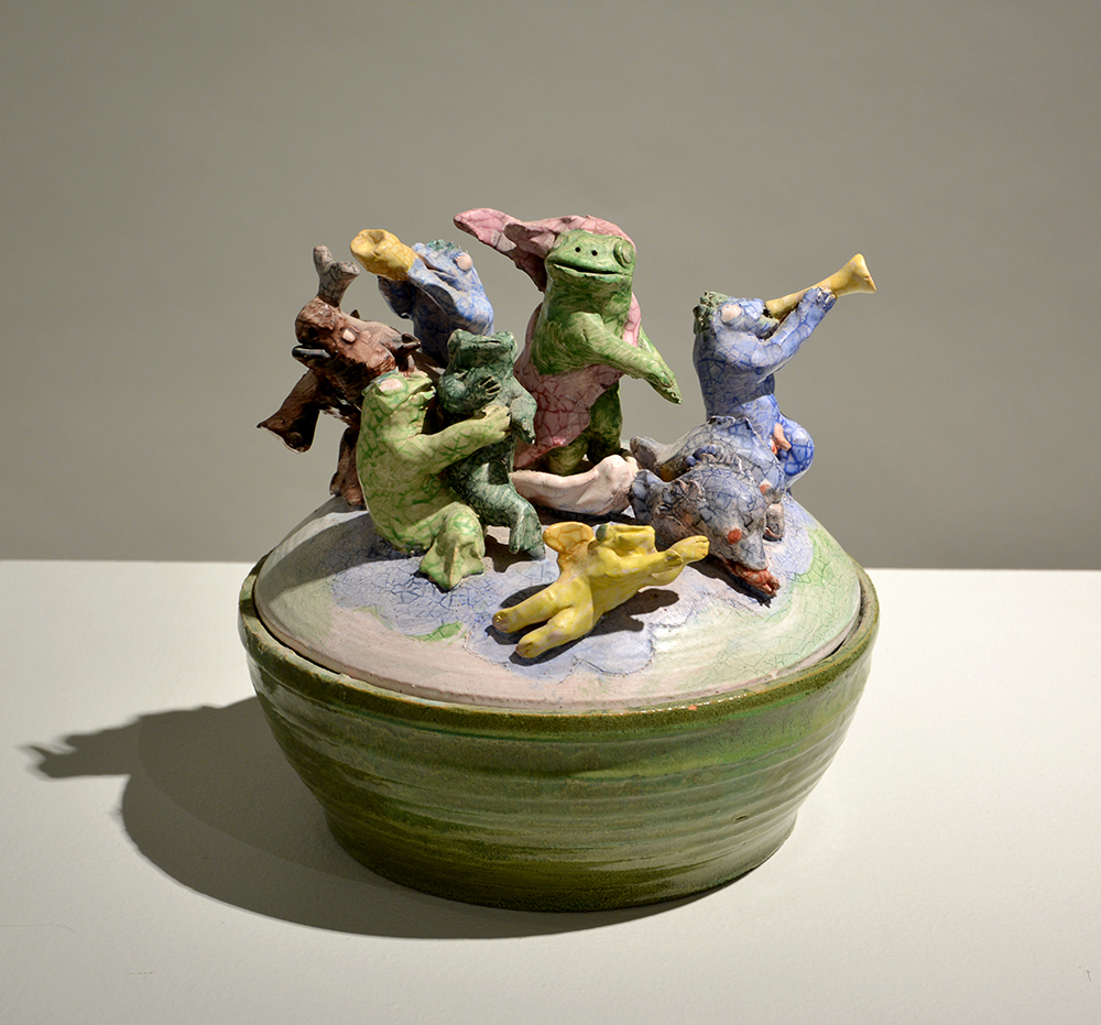 Ceramic bowl, lid has animals playing instruments.