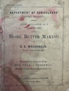 Cover of the 1897 Icelandic edition of Home Butter Making, Dairy Bulletin No. 5 from the Department of Agriculture Dairy Branch, authored by C. C. Macdonald and published in Winnipeg, Manitoba. The cover is stained and worn.