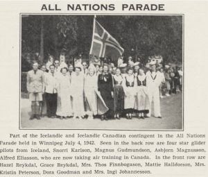 Black-and-white photo of the Icelandic and Icelandic Canadian group marching in the All Nations Parade in Winnipeg on July 4, 1942. The group includes men and women, some in traditional Icelandic dress, gathered around an Icelandic flag.