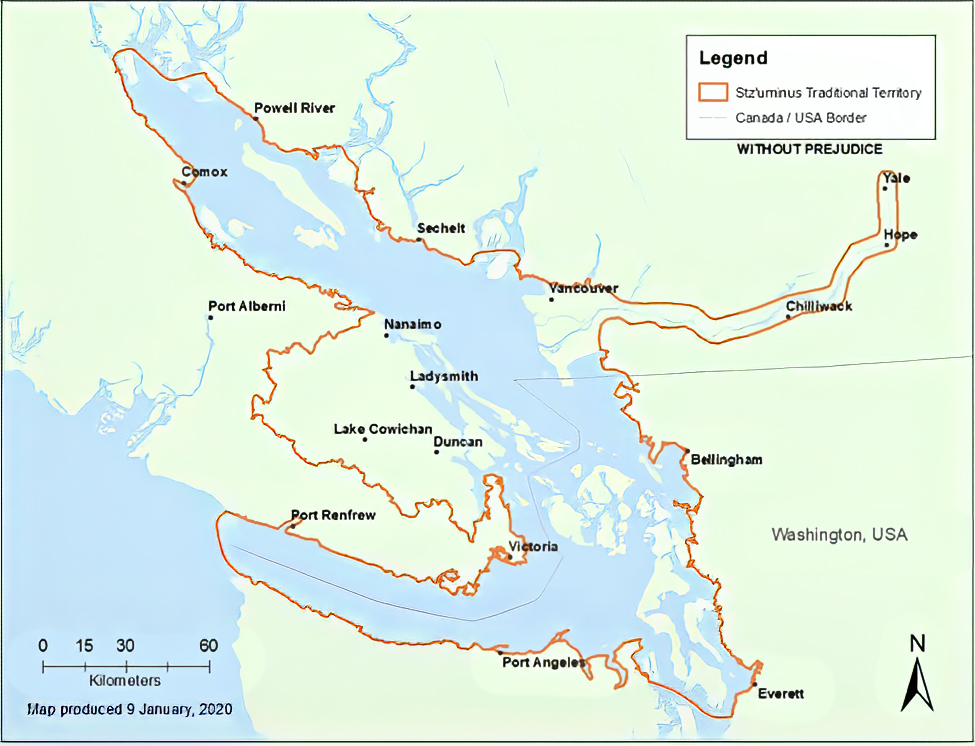 Map showing southeastern Vancouver Island and adjacent mainland in green with sea in blue overlain with the boundary of the traditional territory of the Coast Salish Stz’uminus First Nation outlined in brown.