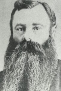 A late 19th century black and white head-shot of a man with a long beard, Lazarus Cohen.
