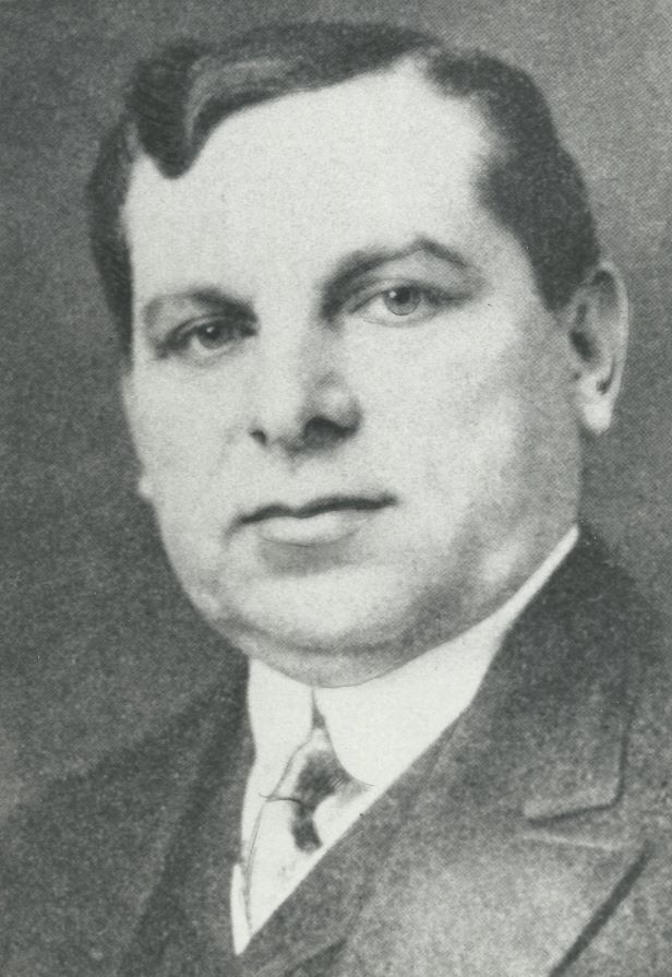 An early 20th century black-and-white head-shot of man in a suit, Lyon Cohen.