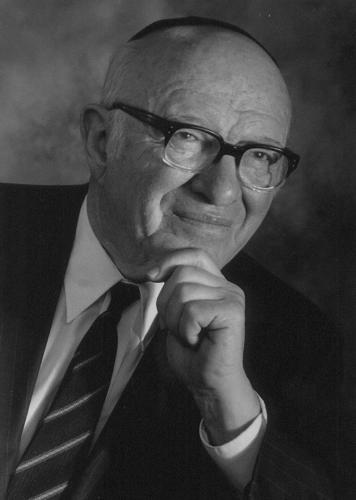 A black-and-white formal photograph of Rabbi Wilfred Shuchat.