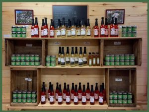 Display of jars of jam and cider bottles