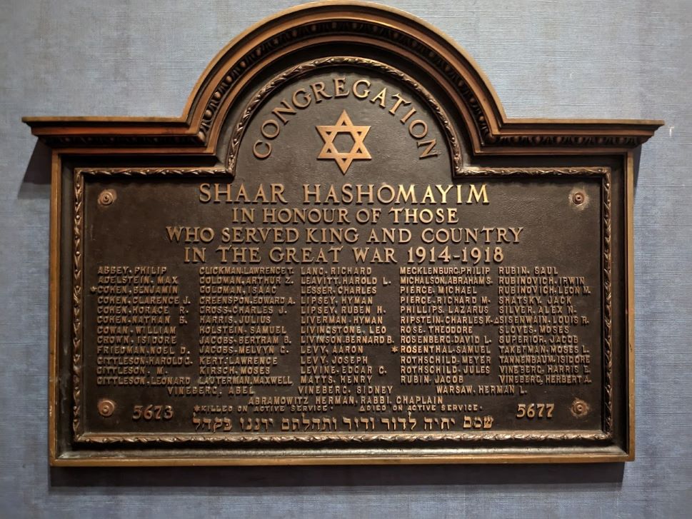 A bronze memorial plaque showing the names of men from Congregation Shaar Hashomayim who served in World War I. Three names are marked with a star or triangle to note they died in service.