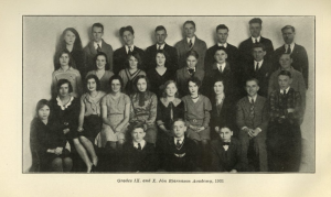 Black-and-white class photo from 1931 showing students and one teacher from Grades 9 and 10 at Jón Bjarnason Academy. The group is arranged in four rows, with young men and women in formal attire, seated and standing against a plain backdrop. The caption beneath the image reads: Grades IX. and X. Jón Bjarnason Academy, 1931.